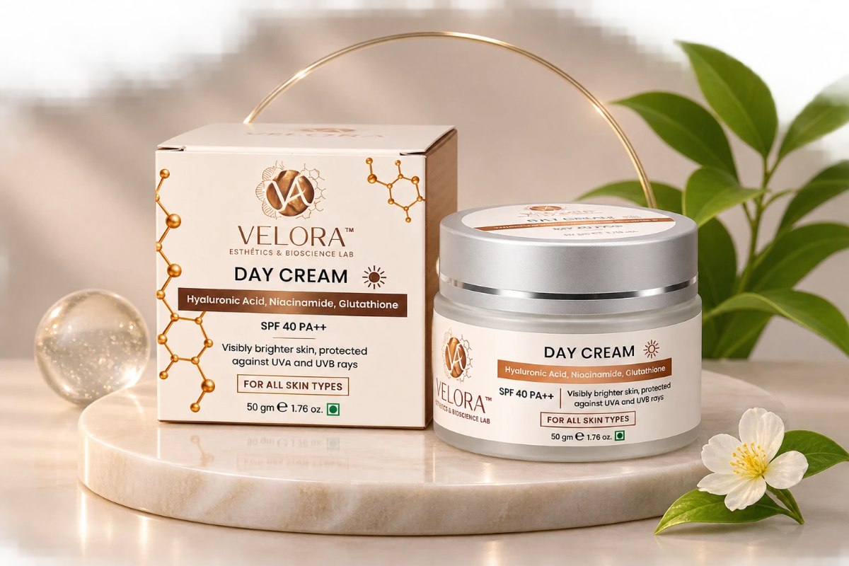 Velora Day Cream jar and carton on a marble pedestal