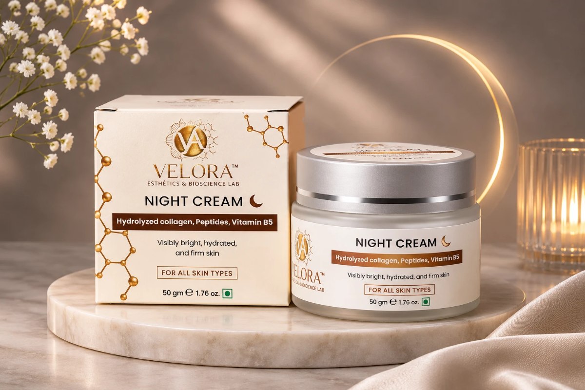 Velora Night Cream jar and carton by candlelight
